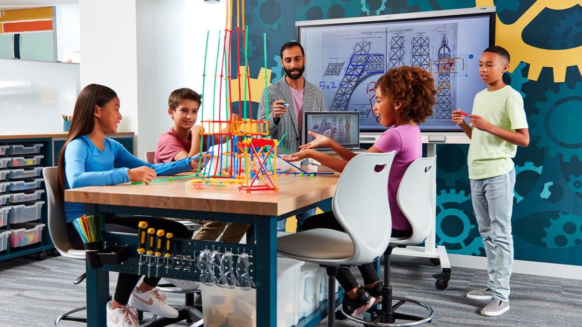 A SMART interactive display being used in a classroom setting where students are engaged in a STEM activity.